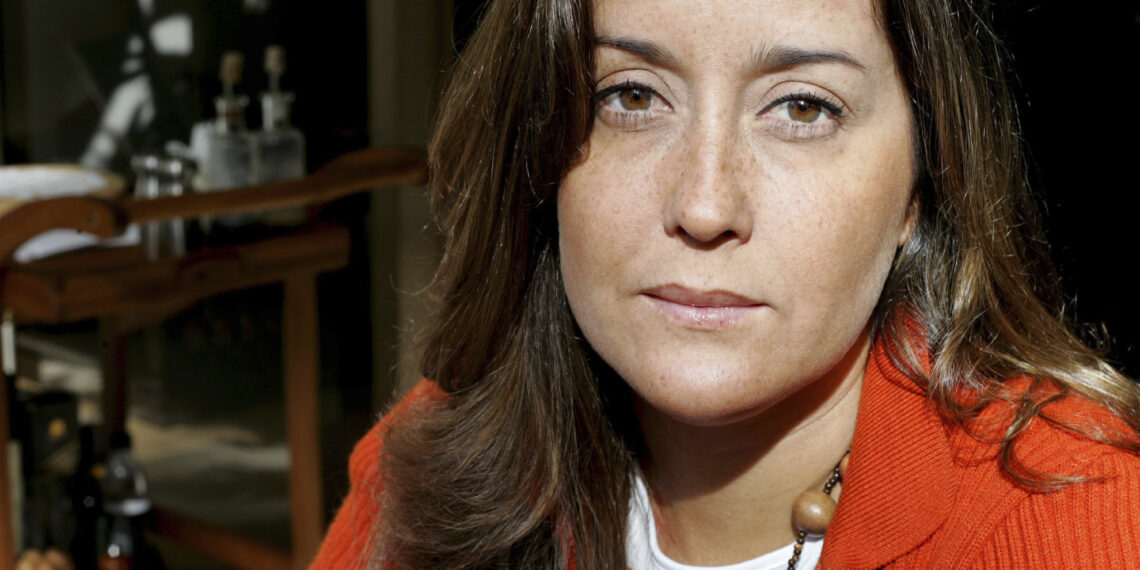 VENEZUELA - JANUARY 18:  Rocio San Miguel poses in the living room of her apartment on January 18, 2006 in Caracas, Venezuela. She believes she was fired from her job at the Consejo Nacional de Frontera for signing a petition she hoped would lead to the ouster of President Hugo Chavez.  (Photo by David Rochkind/Bloomberg via Getty Images)